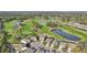 Aerial view of community with golf course and multiple ponds at 7812 Birdie Bend Way, Sarasota, FL 34241