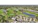 Aerial view of community near golf course and pond at 7812 Birdie Bend Way, Sarasota, FL 34241