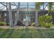 Charming backyard detail showcasing a stone water feature and golf course view at 7812 Birdie Bend Way, Sarasota, FL 34241