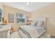 Cozy bedroom with a white bed frame and soft decor at 7812 Birdie Bend Way, Sarasota, FL 34241