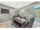 Bright dining room with a rustic table and bench seating at 7812 Birdie Bend Way, Sarasota, FL 34241