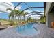 Enclosed pool and spa with waterfall feature and ample patio space at 7812 Birdie Bend Way, Sarasota, FL 34241