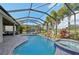 Enclosed pool and spa with waterfall feature and ample patio space at 7812 Birdie Bend Way, Sarasota, FL 34241