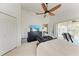 Bedroom with a TV and sliding glass doors leading to a balcony at 803 Montrose Dr # 201, Venice, FL 34293