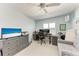 Bedroom with desk, sofa bed, and ample natural light at 803 Montrose Dr # 201, Venice, FL 34293