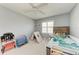 bedroom with bed, play area, and toys at 803 Montrose Dr # 201, Venice, FL 34293