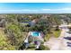 Aerial view of community pool and surrounding neighborhood at 803 Montrose Dr # 201, Venice, FL 34293