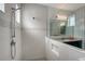 Modern shower with gray tile and glass enclosure at 8063 Waterbend Trl, Sarasota, FL 34240