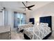 Bedroom with two twin beds and ceiling fan at 8063 Waterbend Trl, Sarasota, FL 34240