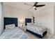 Bedroom with two twin beds and ceiling fan at 8063 Waterbend Trl, Sarasota, FL 34240