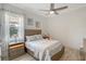 Guest bedroom with light gray walls and a floral bedspread at 8063 Waterbend Trl, Sarasota, FL 34240