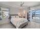 Bright bedroom with water views and ensuite bath at 8063 Waterbend Trl, Sarasota, FL 34240