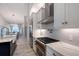 Modern kitchen with stainless steel appliances and white cabinets at 8063 Waterbend Trl, Sarasota, FL 34240