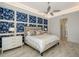 Main bedroom with geometric wall and walk-in closet at 8063 Waterbend Trl, Sarasota, FL 34240