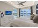 Main bedroom with water views and built-in media console at 8063 Waterbend Trl, Sarasota, FL 34240