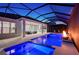 Enclosed pool and spa area with fire pit at 8063 Waterbend Trl, Sarasota, FL 34240