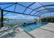 Enjoy lake views from this screened pool and spa at 8063 Waterbend Trl, Sarasota, FL 34240