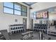 Well-equipped weight room with ample free weights and machines at 8063 Waterbend Trl, Sarasota, FL 34240