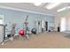 Community gym features modern exercise equipment, including weight machines and exercise balls at 8362 Enclave Way # 103, Sarasota, FL 34243