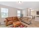 This is a view into the living room showing tile flooring and neutral colored walls at 8362 Enclave Way # 103, Sarasota, FL 34243