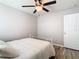 Spacious bedroom with ceiling fan and wood-look floors at 9918 50Th Street E Cir, Parrish, FL 34219