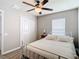 Bedroom with ceiling fan and white metal bed frame at 9918 50Th Street E Cir, Parrish, FL 34219