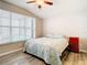 Bright bedroom with large window and wood-look flooring at 9918 50Th Street E Cir, Parrish, FL 34219