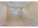 Tile-floored bedroom with neutral walls, recessed lighting, and a bright window at 12410 Osorio Ct # 201, Sarasota, FL 34238