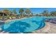 Resort-style pool with sun loungers, palm trees, and a relaxing atmosphere at 12410 Osorio Ct # 201, Sarasota, FL 34238