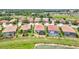 An aerial view featuring multiple homes with screened in patios and pool at 12675 Richezza Dr, Venice, FL 34293