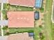 Aerial view of a home with a tile roof and a screened in patio at 12675 Richezza Dr, Venice, FL 34293