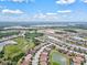 Wide shot aerial view of a neighborhood with lakes and lush vegetation at 12675 Richezza Dr, Venice, FL 34293