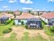 A home's backyard features a screened in patio with outdoor furniture at 12675 Richezza Dr, Venice, FL 34293