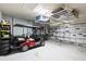 Spacious garage featuring ample storage solutions and room for a golf cart at 12675 Richezza Dr, Venice, FL 34293