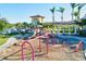 Bright and colorful playground with swings, slide and tower for safe, active Gathering fun at 12675 Richezza Dr, Venice, FL 34293