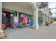 Boutique storefront with colorful clothing display and covered walkway, inviting shoppers to browse at 12675 Richezza Dr, Venice, FL 34293