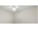 Bright room with ceiling fan and fresh white walls at 16904 Vardon Ter # 102, Bradenton, FL 34211