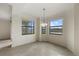 Bright dining room with tiled floor and large windows showcasing exterior views at 16904 Vardon Ter # 102, Bradenton, FL 34211