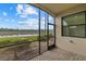 Screened lanai with brick pavers offers serene lake views at 16904 Vardon Ter # 102, Bradenton, FL 34211