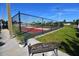 Two pickleball courts with red and green surface, surrounded by a fence at 1863 Palm Springs St, Sarasota, FL 34234