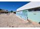 Pool area with tiki hut, lounge chairs and a mural at 1863 Palm Springs St, Sarasota, FL 34234