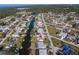 Aerial view of a neighborhood featuring waterfront homes with private docks and canal access at 1956 Greenlawn Dr, Englewood, FL 34223