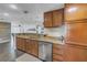 Beautifully remodeled kitchen boasts granite countertops, stainless appliances, and wood cabinetry at 1956 Greenlawn Dr, Englewood, FL 34223