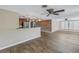 Spacious living room showcasing wood flooring, a modern accent wall, and an open layout at 1956 Greenlawn Dr, Englewood, FL 34223