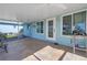 Enclosed patio featuring tiled floor, light blue walls, and a view of the yard at 1956 Greenlawn Dr, Englewood, FL 34223