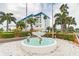 Beautiful fountain with intricate sculptures, set against the backdrop of the condo buildings at 2 Causeway Blvd # 206, Dunedin, FL 34698