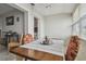 Cozy dining area with natural light and stylish chairs, adjacent to the kitchen at 2 Causeway Blvd # 206, Dunedin, FL 34698