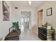 Bright hallway with stylish decor and a view into the open, sunlit rooms of the home at 2 Causeway Blvd # 206, Dunedin, FL 34698