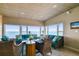 Bright living room with water views and comfortable seating, perfect for relaxation at 2 Causeway Blvd # 206, Dunedin, FL 34698