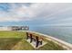 Bench by the water offers serene views and a perfect spot for relaxation and contemplation at 2 Causeway Blvd # 206, Dunedin, FL 34698